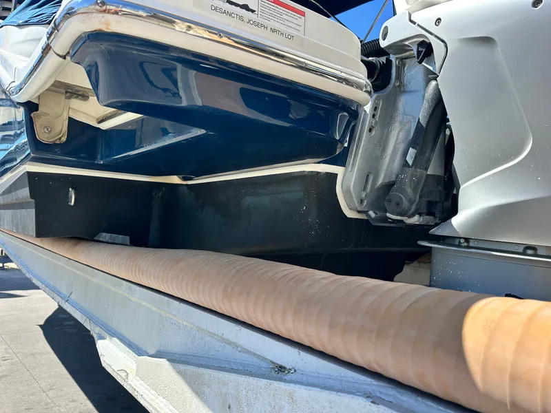 Slide: The Image of 2019 Sea Ray SDX 290 Outboard boat on trailer, close-up of hull and engine. - 18