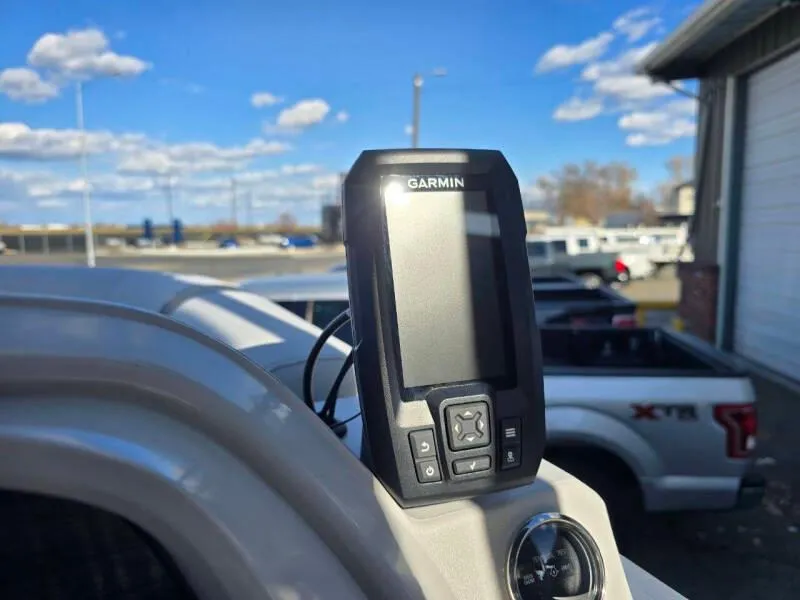 Slide: The Image of Garmin device on 2025 Berkshire 20 CL boat dashboard, outdoor setting with blue sky. - 12