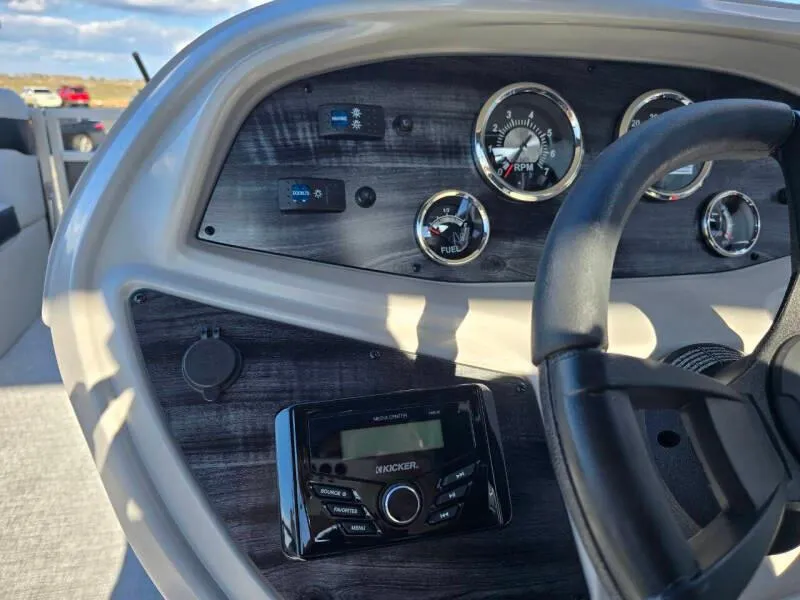 Slide: The Image of Dashboard of 2025 Berkshire 20 CL boat with steering wheel and control panel. - 13