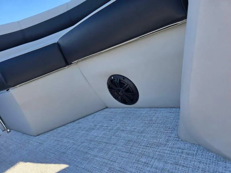 Slide: The Image of 2025 Berkshire 20 CL boat interior with black seating and speaker detail. - 14