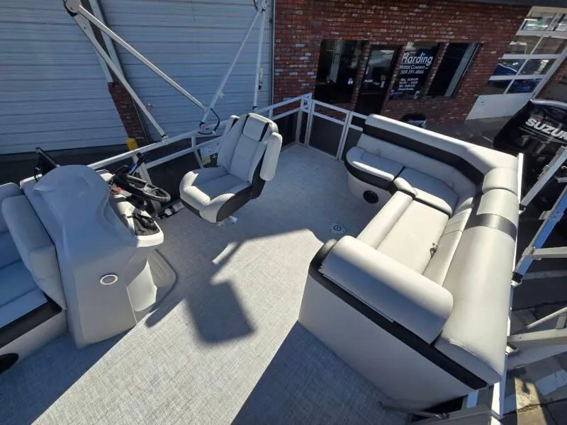 Slide: The Image of 2025 Berkshire 20 CL pontoon boat interior with modern seating and steering console. - 9
