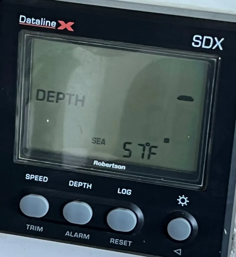 Slide: The Image of Depth gauge display on a 1997 Carver 350 Mariner, showing sea temperature at 57°F. - 35