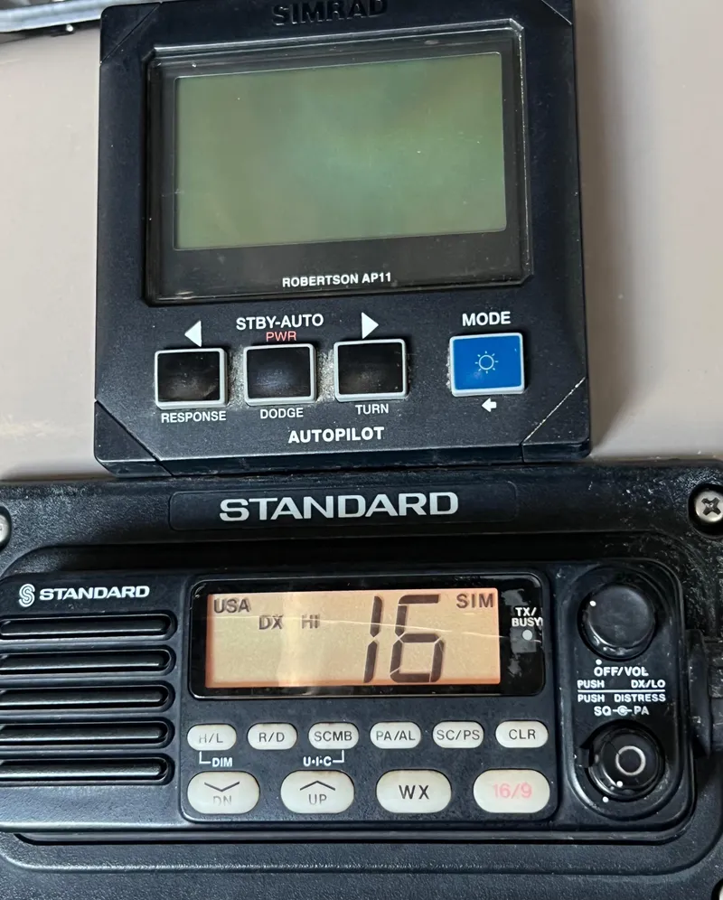 Slide: The Image of Simrad autopilot and Standard marine radio on a 1997 Carver 350 Mariner. - 36
