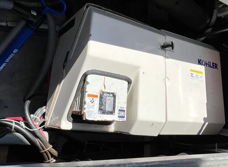 Slide: The Image of Kohler generator in a 1997 Carver 350 Mariner boat engine compartment. - 38