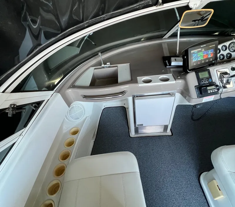 Slide: The Image of 1997 Carver 350 Mariner helm with steering wheel, gauges, and controls. - 13