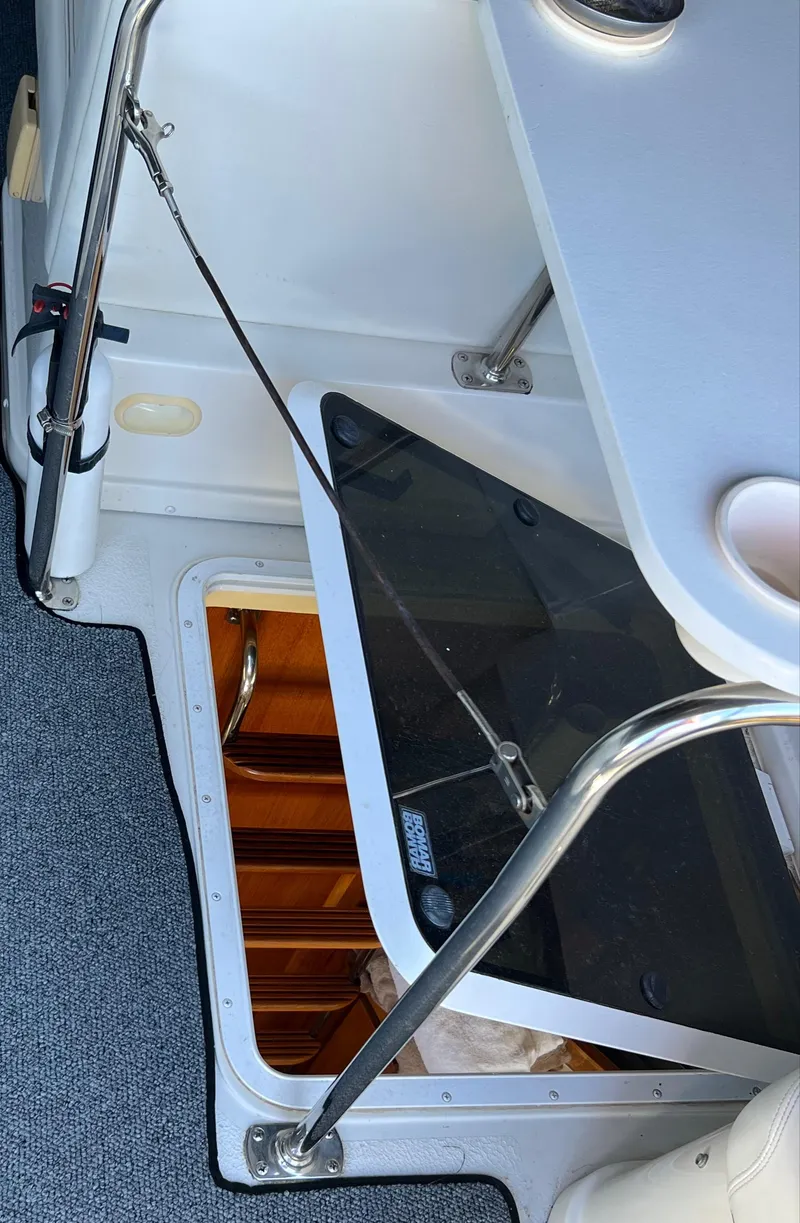 Slide: The Image of 1997 Carver 350 Mariner interior with open hatch and storage compartment. - 16