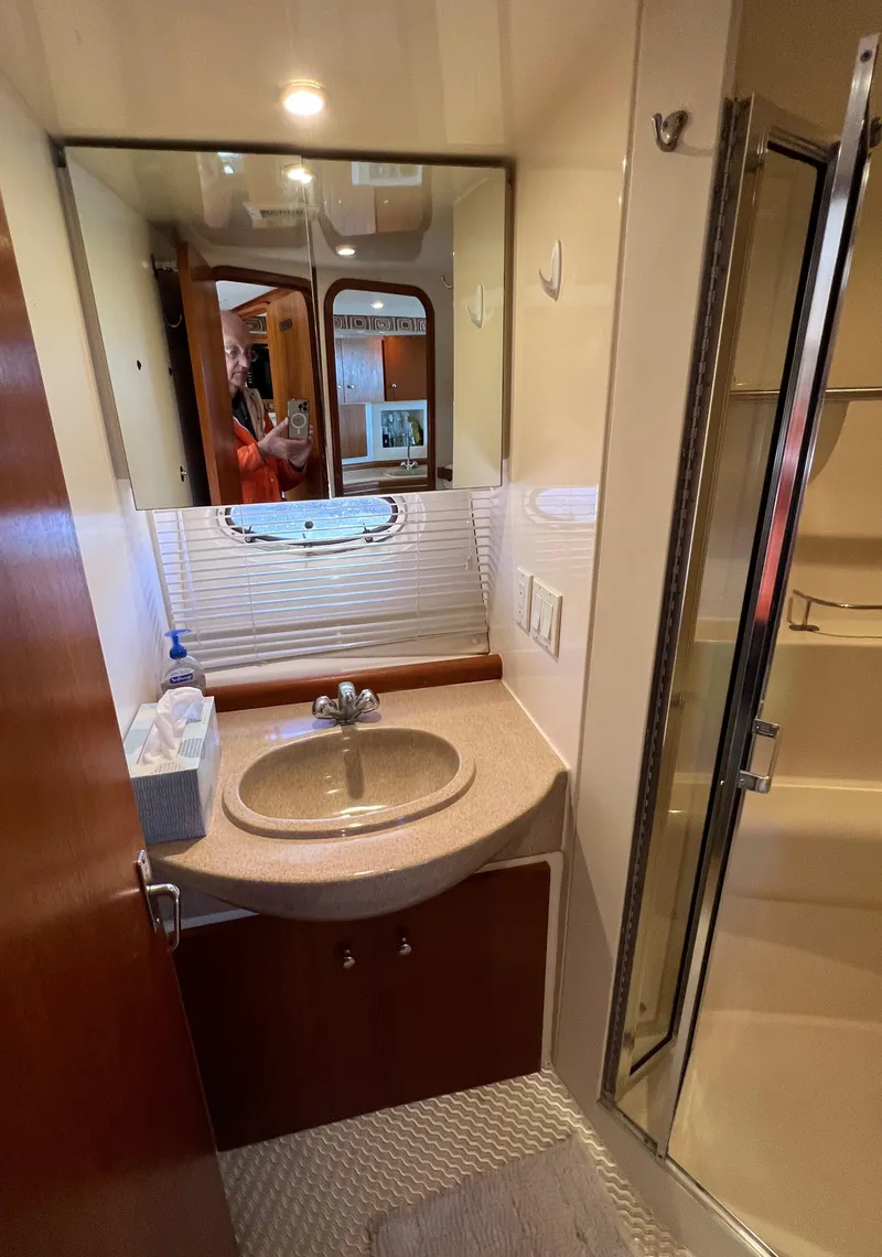 Slide: The Image of Bathroom interior of a 1997 Carver 350 Mariner yacht with sink and shower. - 31