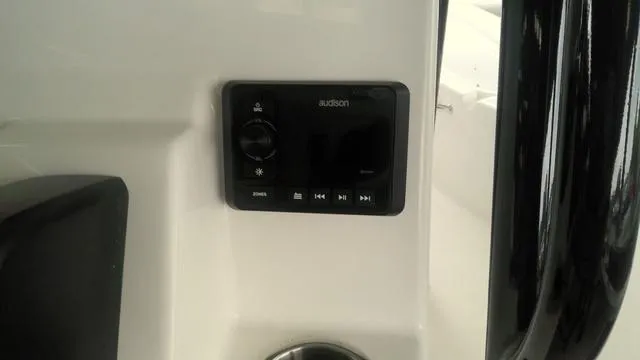 Slide: The Image of 2025 Sea Pro 230 Bay boat audio control panel, featuring Audison system. - 13