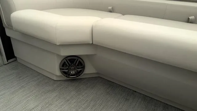 Slide: The Image of Luxurious seating on 2025 Godfrey Pontoons Xperience 2286 SBX with integrated speaker. - 15