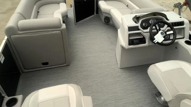 Slide: The Image of 2025 Godfrey Pontoons Xperience 2286 SBX interior with plush seating and modern helm. - 16