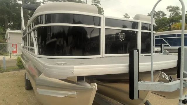 Slide: The Image of 2025 Godfrey Pontoons Xperience 2286 SBX Sport Tube, black exterior, on trailer. - 2