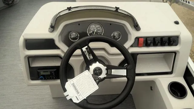 Slide: The Image of 2025 Godfrey Pontoons Xperience 2286 SBX Sport Tube dashboard with steering wheel and controls. - 7
