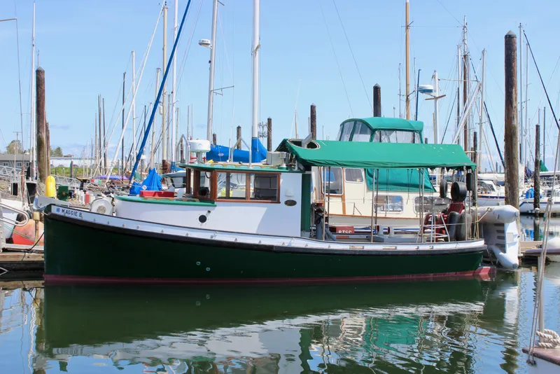 The Image of Vintage 1961 Custom 32' William Garden Tugboat docked in a marina. - 0