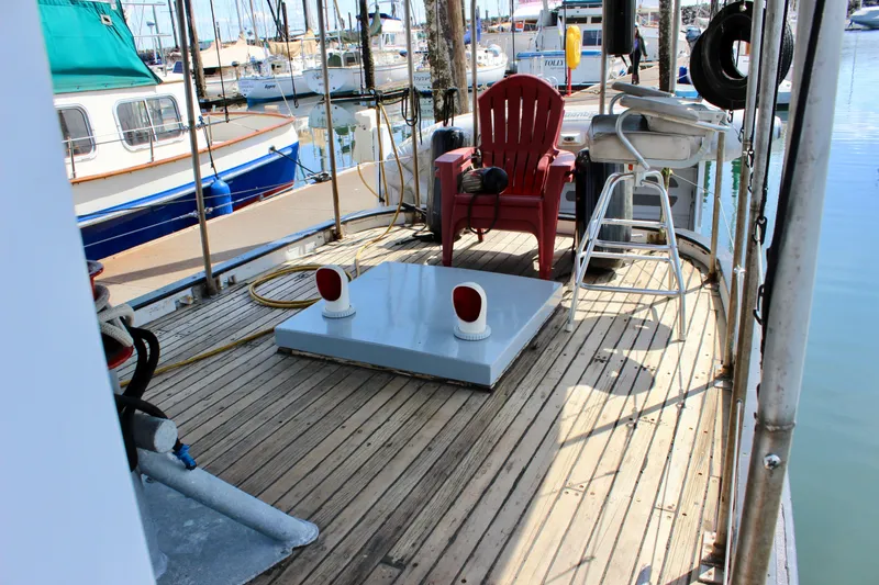 Slide: The Image of 1961 Custom 32' William Garden Tug deck with seating and nautical equipment. - 13