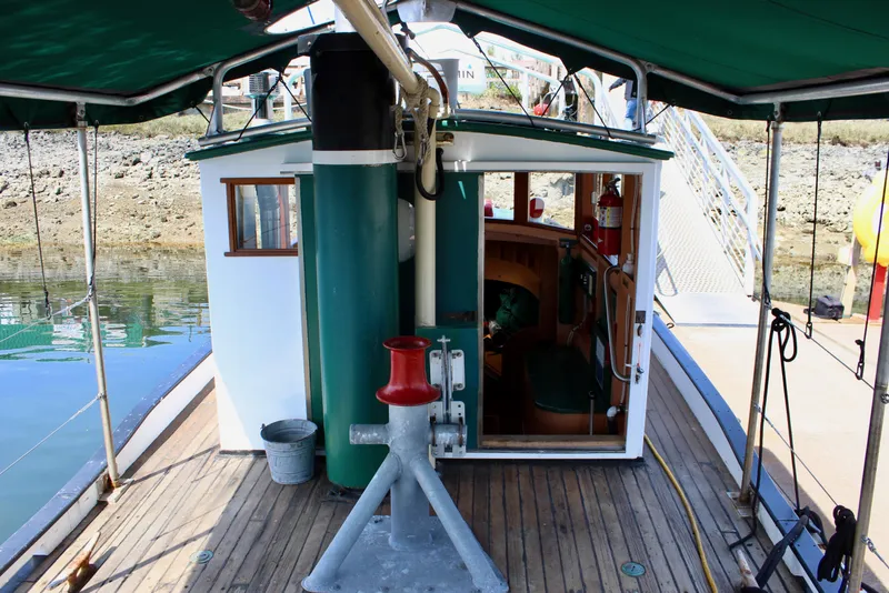 Slide: The Image of 1961 Custom 32' William Garden Tugboat with wooden deck and green canopy. - 16