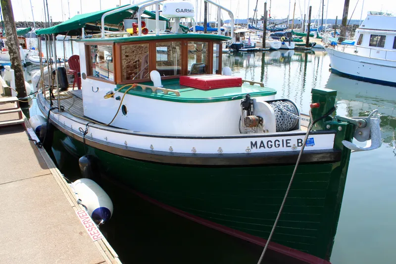Slide: The Image of Vintage 1961 Custom 32' William Garden Tugboat docked in a marina. - 2