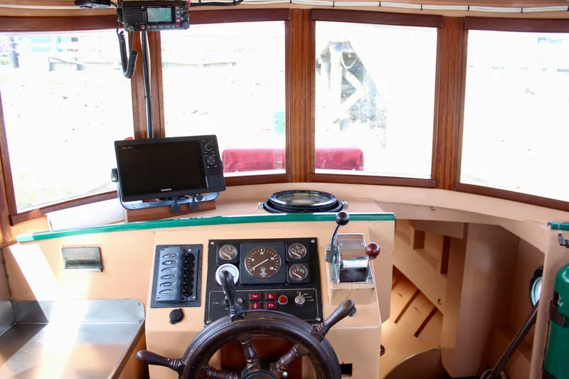 Slide: The Image of 1961 Custom 32' William Garden Tugboat helm with vintage controls and modern navigation equipment. - 24