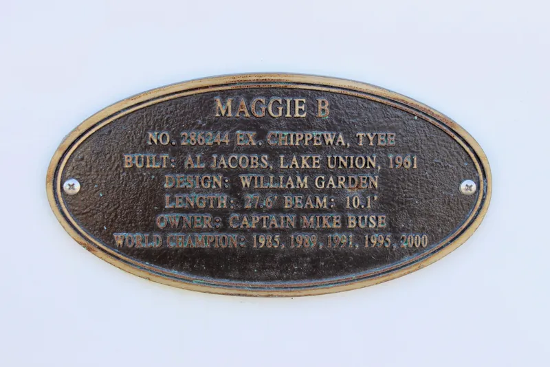 Slide: The Image of Plaque of 1961 Custom 32' William Garden Tug, "Maggie B," with historical details. - 4