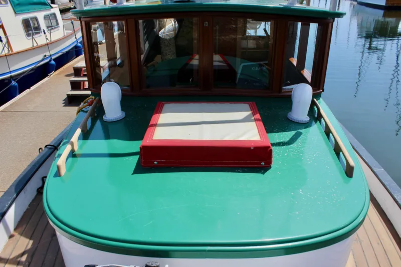 Slide: The Image of Vintage 1961 Custom 32' William Garden Tugboat with green deck and wooden cabin. - 9