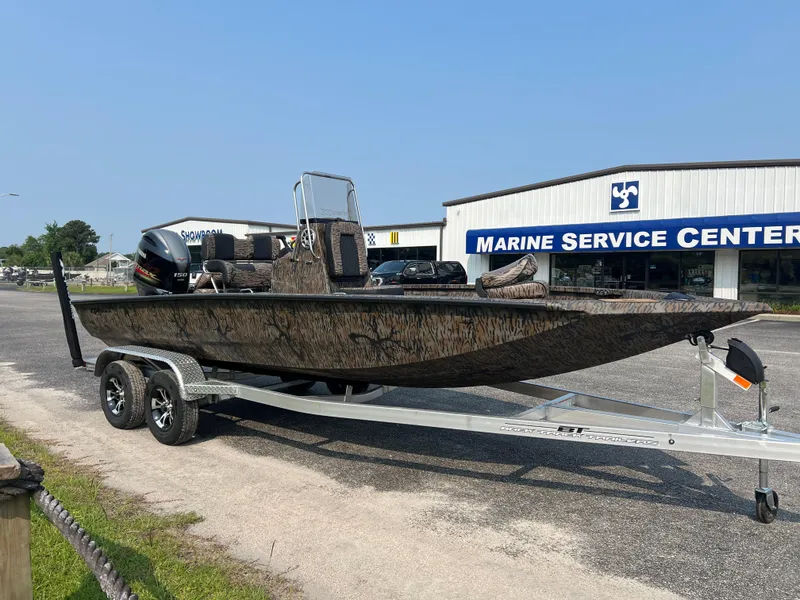 Slide: The Image of 2025 Xpress H20B boat on trailer outside Marine Service Center. - 5