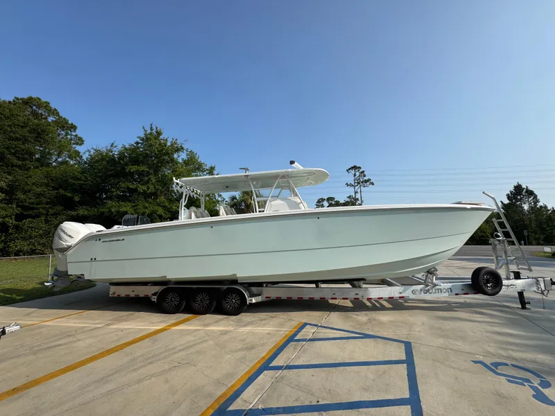 Slide: The Image of 2022 Invincible 40 Catamaran on trailer, parked outdoors, side view. - 11