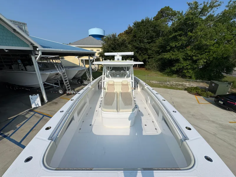 Slide: The Image of 2022 Invincible 40 Catamaran docked, showcasing spacious deck and modern design. - 23