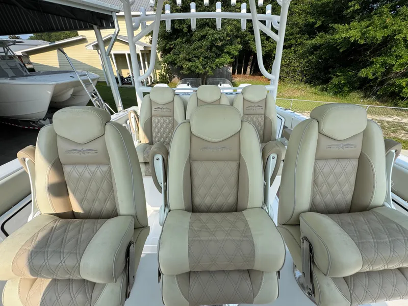 Slide: The Image of Luxurious seating on 2022 Invincible 40 Catamaran, featuring plush, diamond-stitched upholstery. - 28