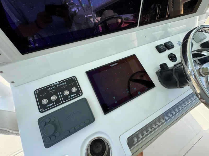 Slide: The Image of Control panel of 2022 Invincible 40 Catamaran with touchscreen and steering wheel. - 33
