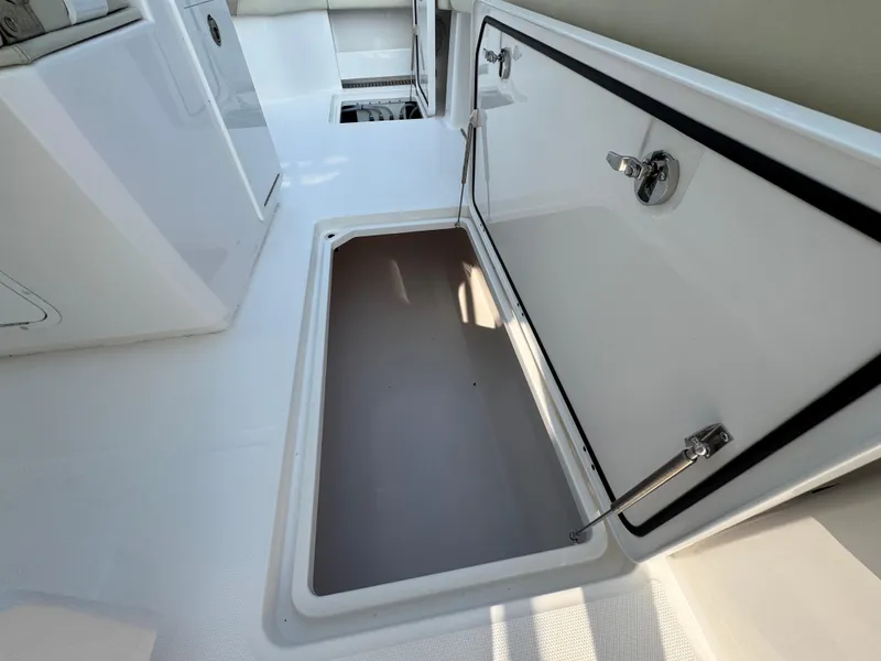 Slide: The Image of Open storage compartment on 2022 Invincible 40 Catamaran boat deck. - 36