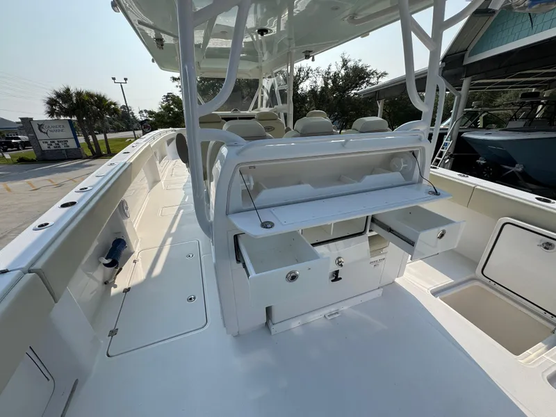 Slide: The Image of 2022 Invincible 40 Catamaran interior with seating and storage compartments. - 38