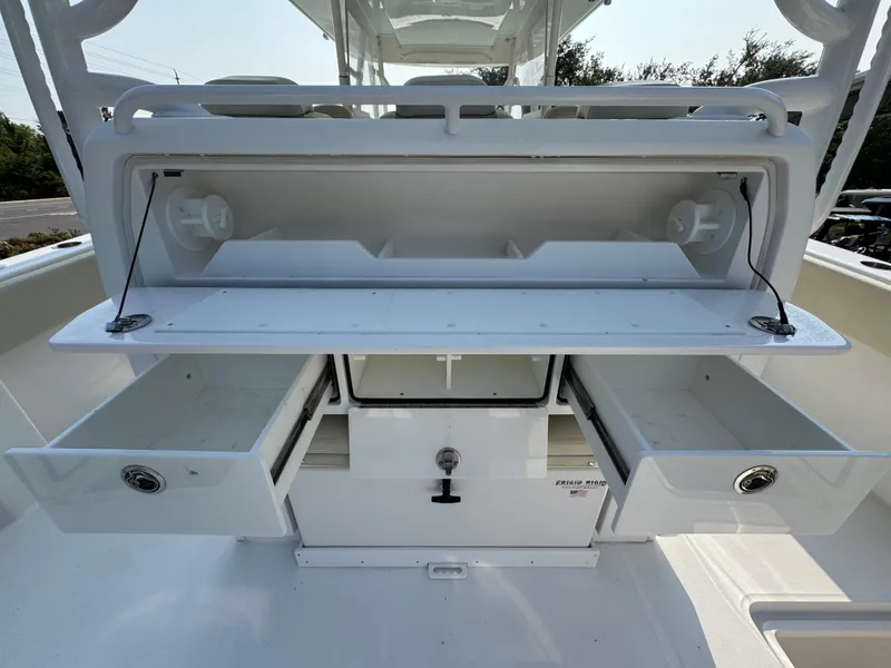 Slide: The Image of 2022 Invincible 40 Catamaran storage compartments with open drawers and shelves. - 39