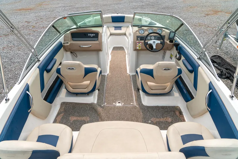 Slide: The Image of 2014 Chaparral 21 Ski & Fish H2O boat interior with blue and beige seating. - 11
