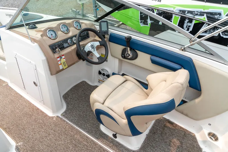 Slide: The Image of 2014 Chaparral 21 Ski & Fish H2O boat interior with steering wheel and dashboard. - 12