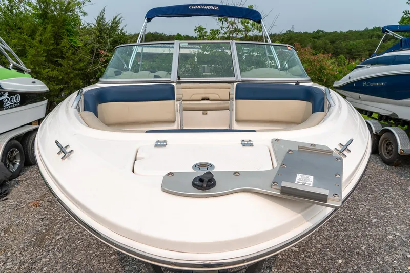Slide: The Image of 2014 Chaparral 21 Ski & Fish H2O boat, front view, parked on gravel. - 17