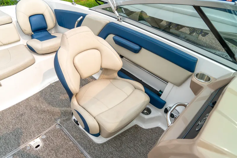 Slide: The Image of 2014 Chaparral 21 Ski & Fish H2O boat interior with beige and blue seating. - 20