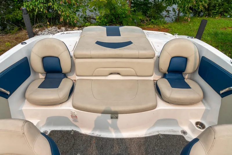Slide: The Image of 2014 Chaparral 21 Ski & Fish H2O boat interior with beige and blue seating. - 21