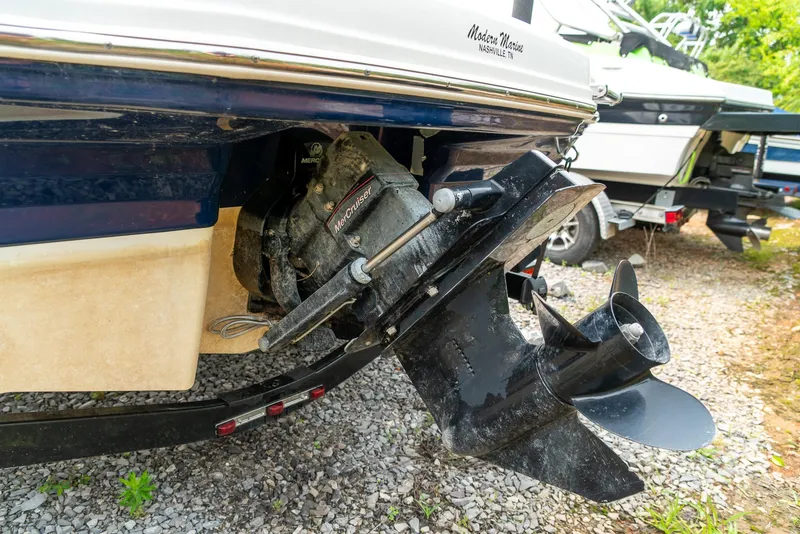 Slide: The Image of 2014 Chaparral 21 Ski & Fish H2O boat propeller and stern drive on gravel. - 23