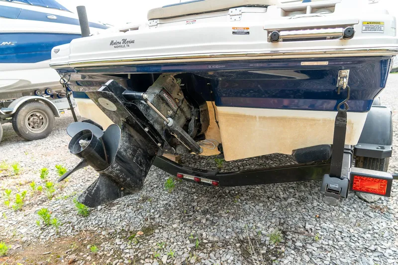 Slide: The Image of 2014 Chaparral 21 Ski & Fish H2O boat rear view with trailer. - 24
