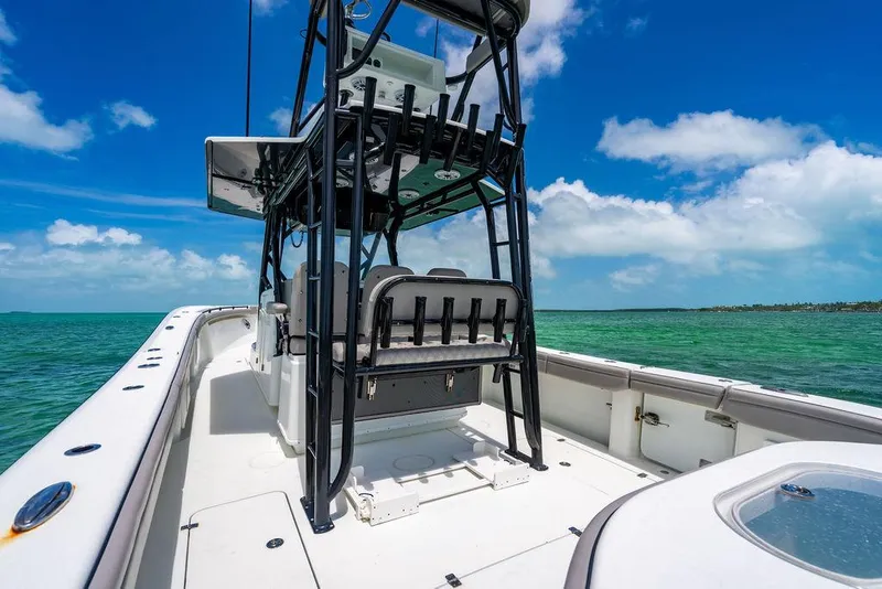 Slide: The Image of 2015 Yellowfin CC boat on turquoise water under clear blue sky. - 15