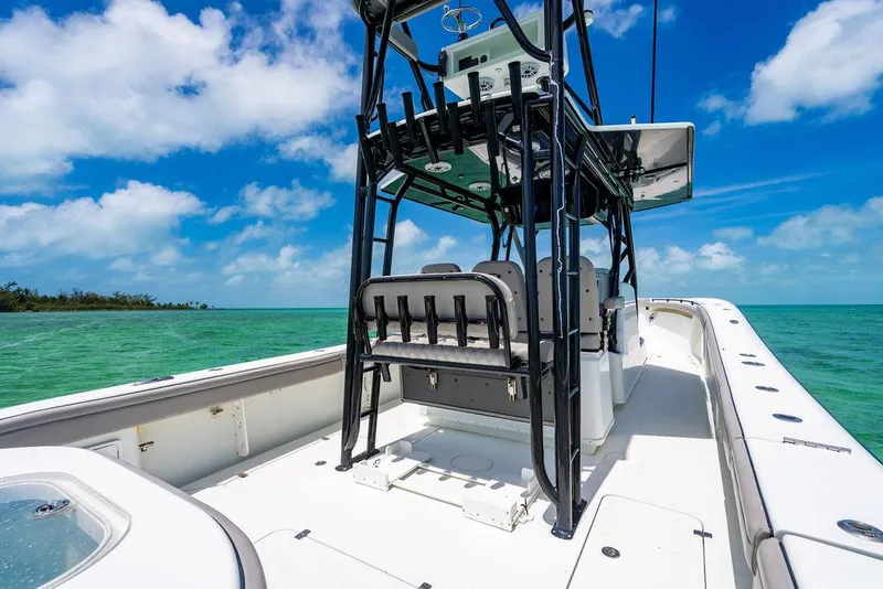 Slide: The Image of 2015 Yellowfin CC boat on turquoise water under a clear blue sky. - 16
