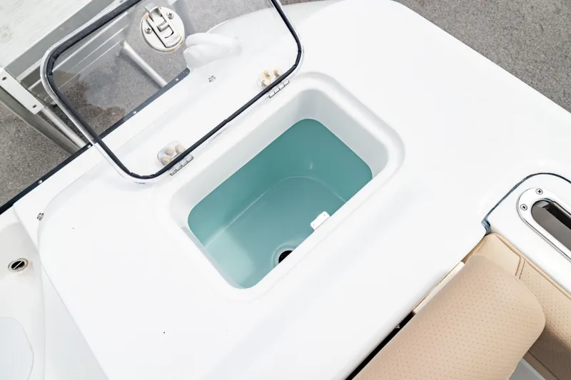 Slide: The Image of Livewell compartment on 2026 Edgewater 248 CX boat, featuring a sleek design. - 12