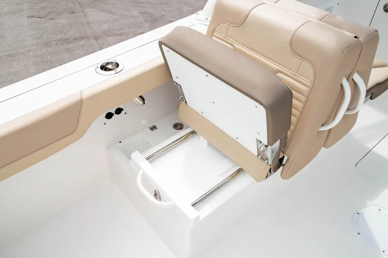 Slide: The Image of 2026 Edgewater 248 CX boat seat with storage drawer, beige upholstery. - 16