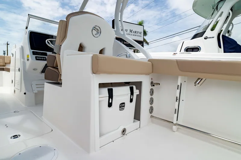 Slide: The Image of 2026 Edgewater 248 CX boat interior with seating and storage compartment. - 18