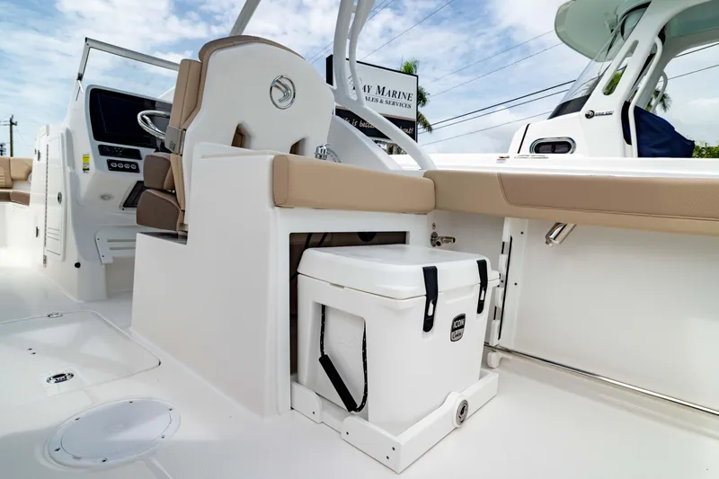 Slide: The Image of 2026 Edgewater 248 CX boat interior with seating and cooler storage. - 20