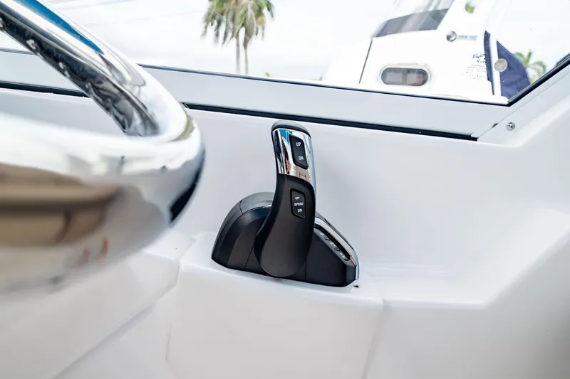 Slide: The Image of Throttle control of 2026 Edgewater 248 CX boat, featuring sleek design and modern technology. - 23