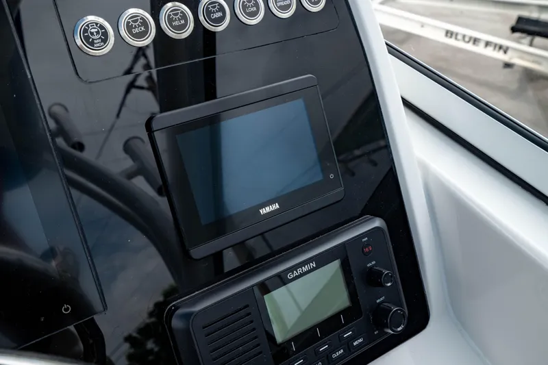 Slide: The Image of Edgewater 248 CX 2026 dashboard with Yamaha and Garmin displays. - 27