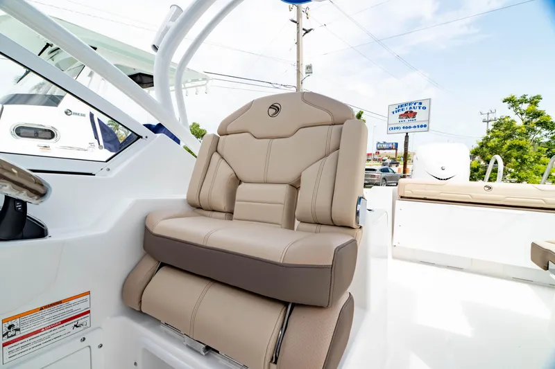 Slide: The Image of Luxurious seating on 2026 Edgewater 248 CX boat, featuring beige upholstery and modern design. - 3