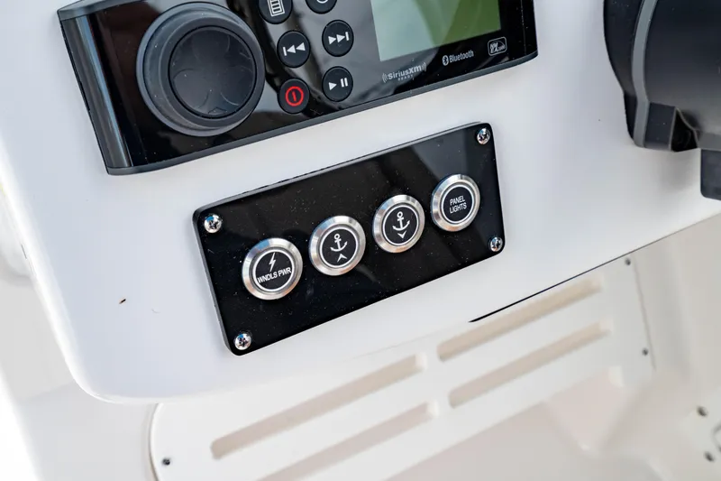 Slide: The Image of Control panel of 2026 Edgewater 248 CX boat with buttons and display. - 30