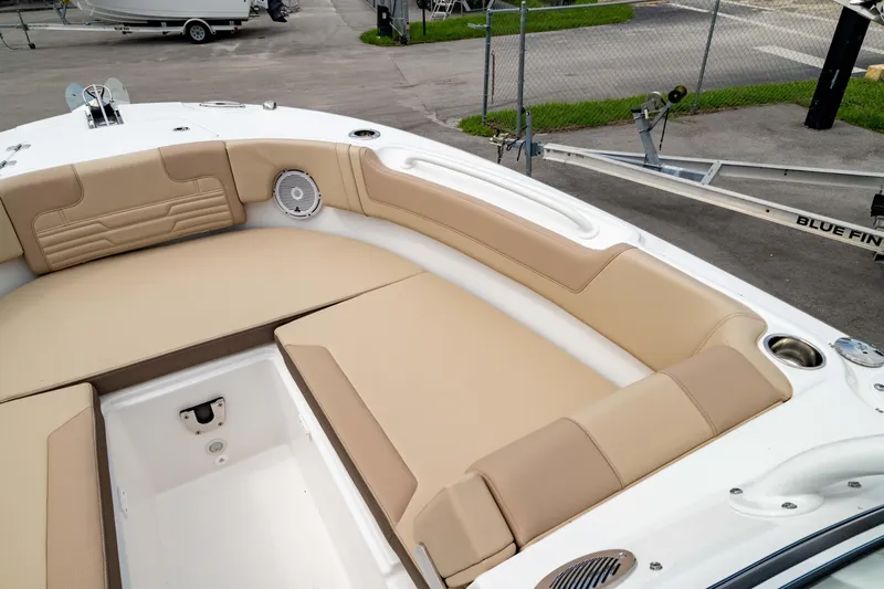 Slide: The Image of Luxurious seating on 2026 Edgewater 248 CX boat, featuring beige cushions and sleek design. - 39