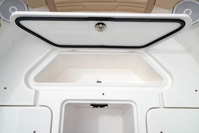 Slide: The Image of 2026 Edgewater 248 CX boat storage compartment with open hatch, showcasing spacious interior design. - 42